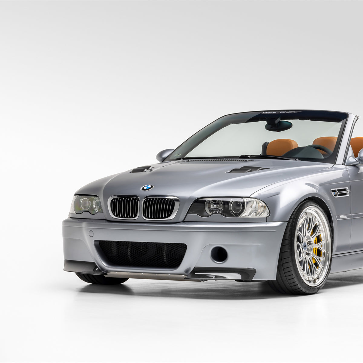 BMW E46 M3 V20 carbon fiber vented hood by Vorsteiner Aero, glossy finish with aerodynamic vents, designed for 2000-2006 models