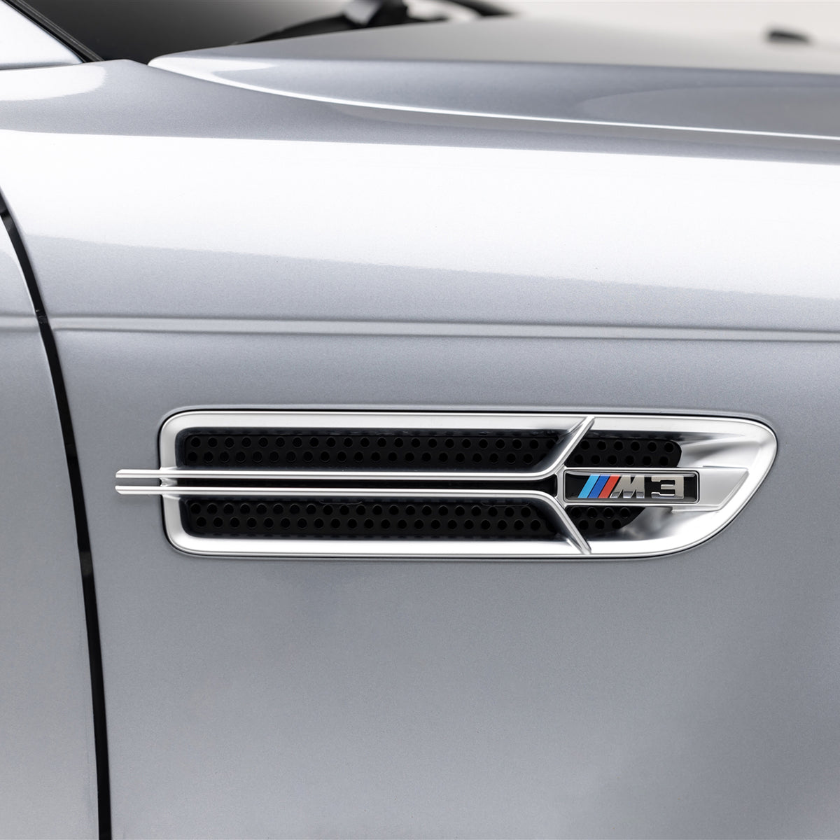 Nickel plated Aero side grilles for 2000-2006 BMW E46 M3 V20 by Vorsteiner Aerodynamics, showing detailed close-up of grille design.