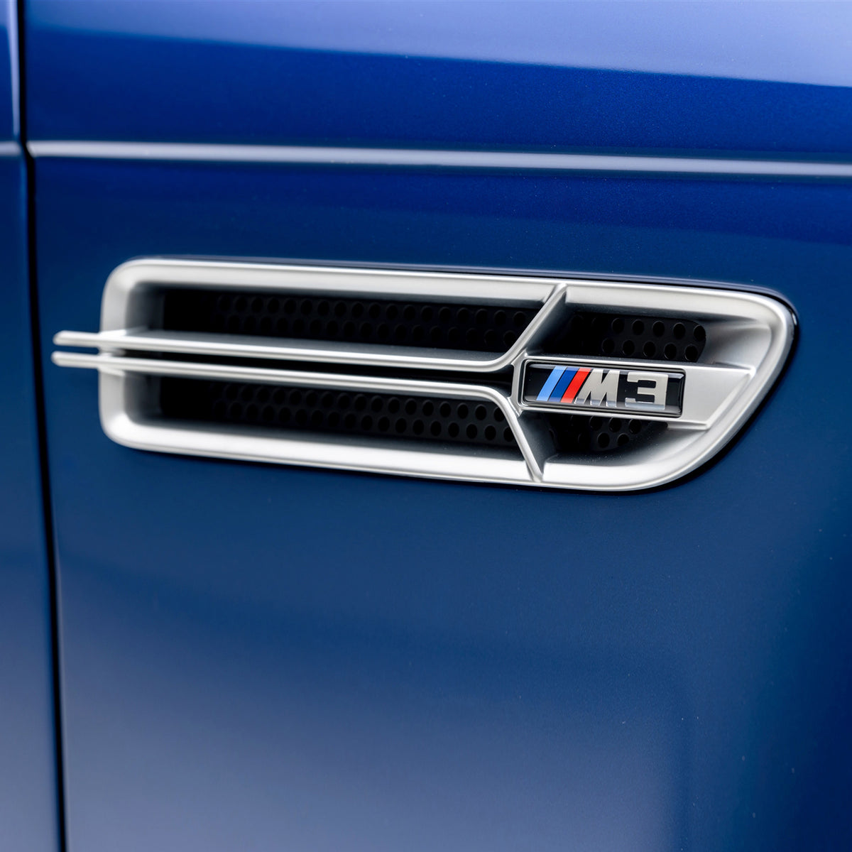 Nickel-plated Aero side grilles for 2000-2006 BMW E46 M3 V20 by Vorsteiner Aerodynamics, showcasing sleek metallic finish and precise fitments.