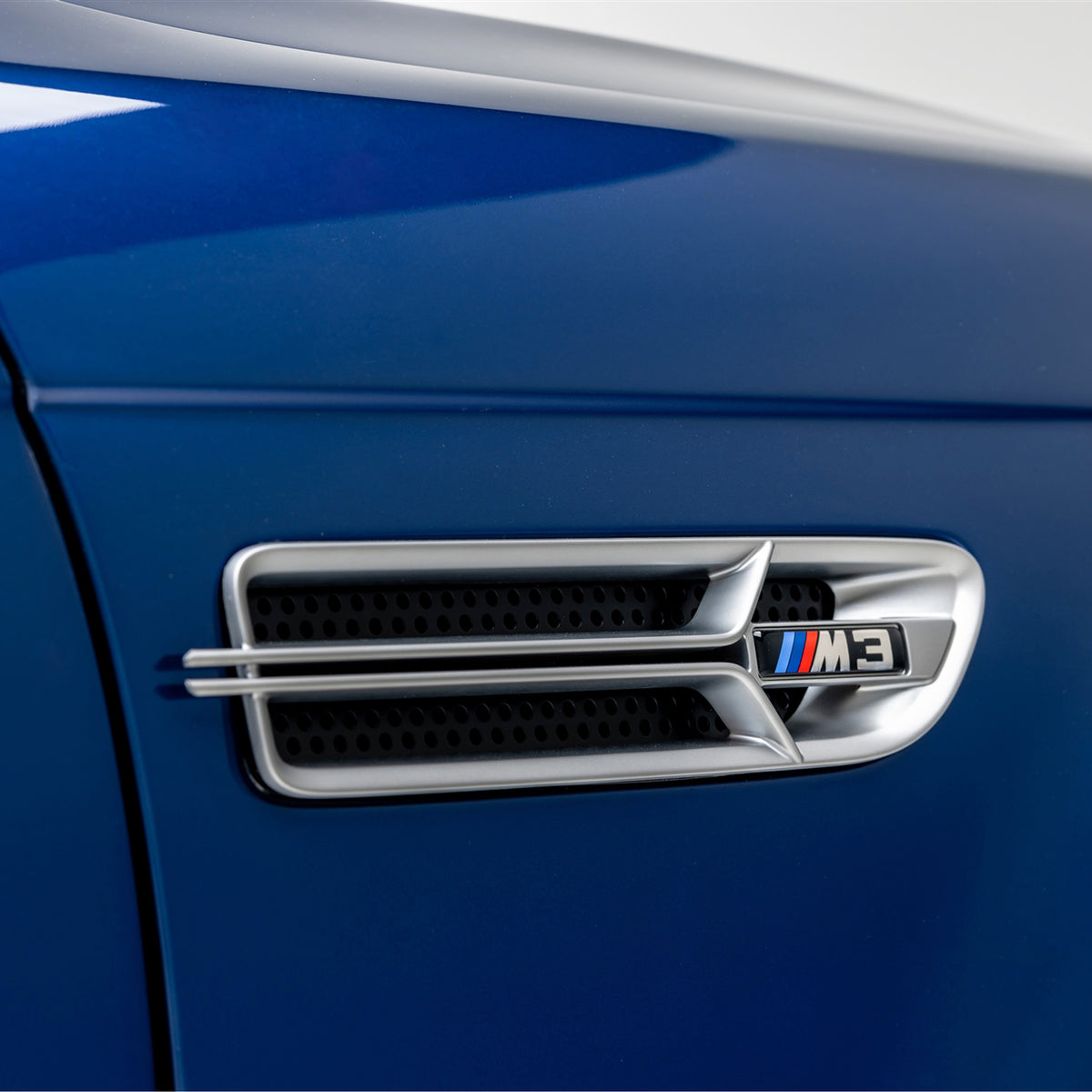 Nickel-plated aero side grilles for BMW E46 M3 V20 Limited by Vorsteiner Aerodynamics, showing detailed close-up of grille design.