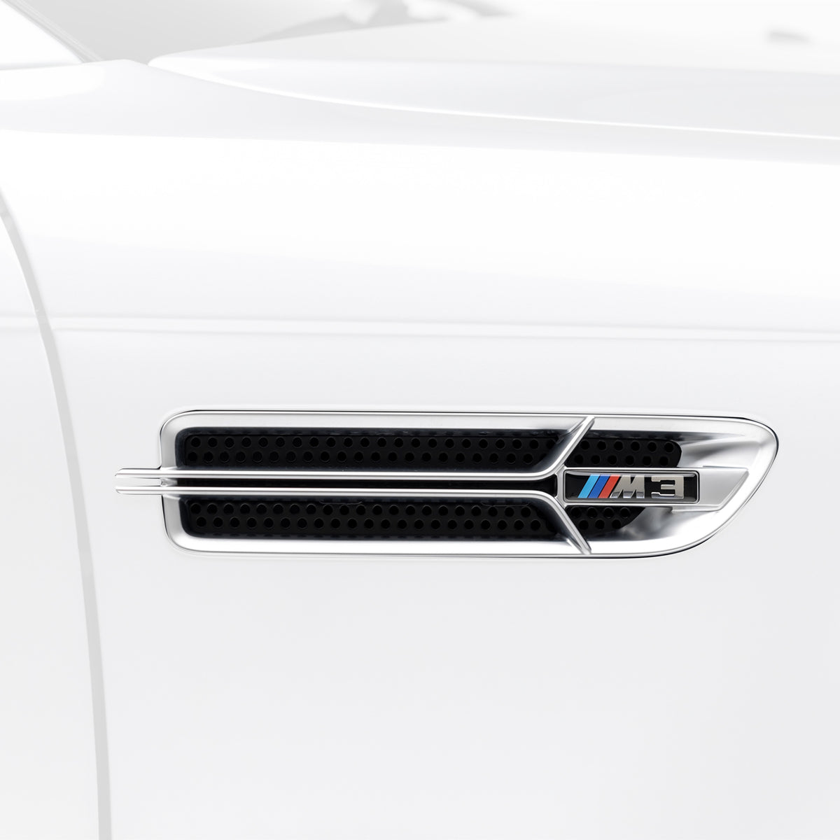 Nickel-plated aero side grilles for 2000-2006 BMW E46 M3 V20 by Vorsteiner Aerodynamics, showcasing sleek design and premium finish.