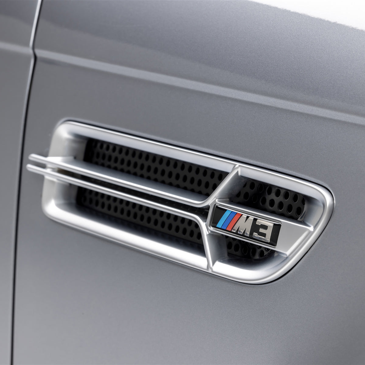 Nickel-plated Aero side grilles for BMW E46 M3 V20 Limited, designed by Vorsteiner Aerodynamics, showcasing sleek automotive styling.