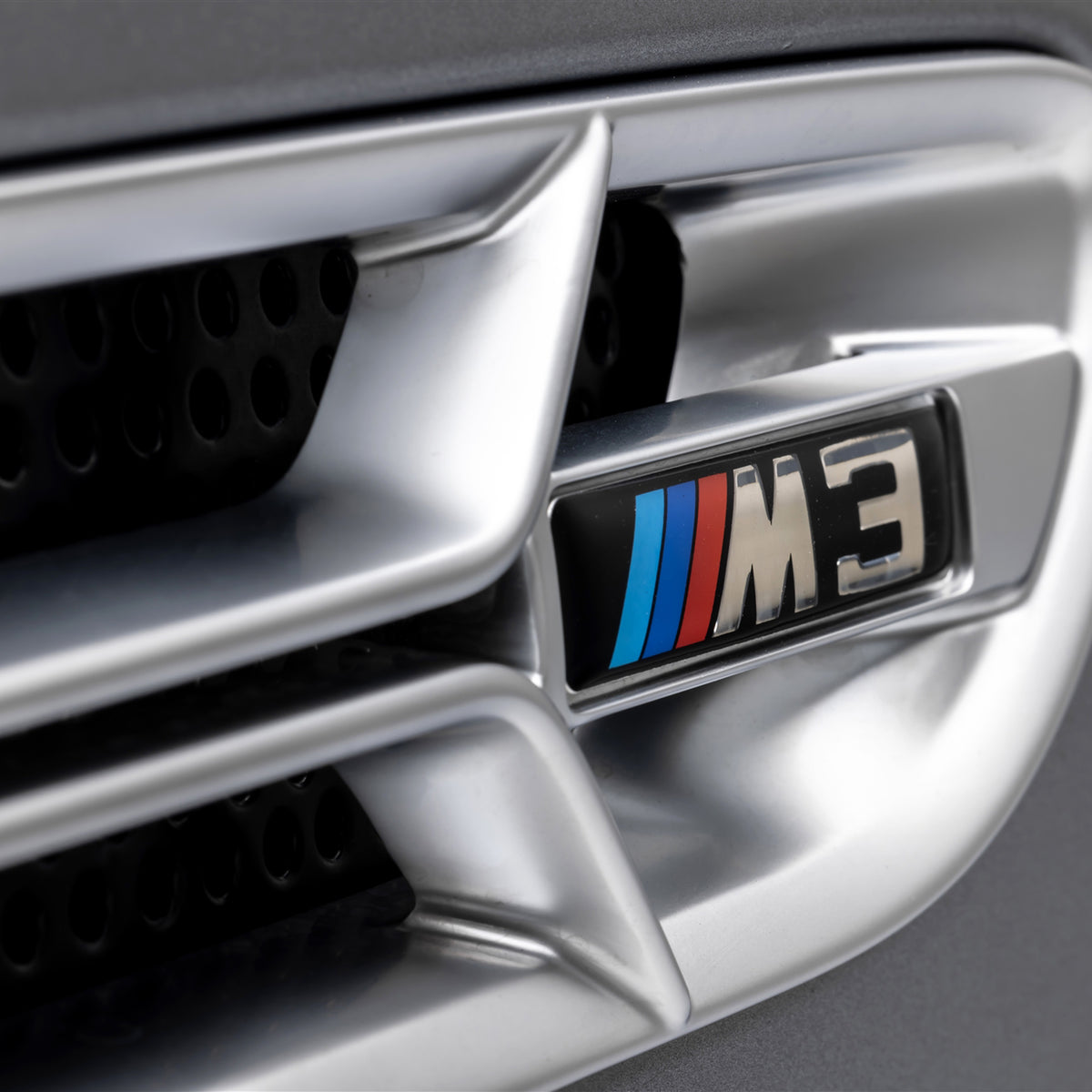 Nickel-plated Aero side grilles for BMW E46 M3 V20 Limited, designed by Vorsteiner Aerodynamics, showcasing sleek metallic finish.