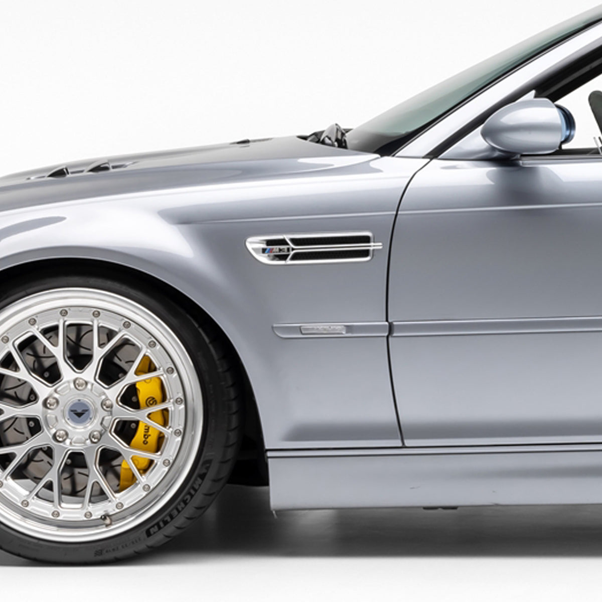 Nickel-plated Aero side grilles for BMW E46 M3 V20 Limited, designed by Vorsteiner Aerodynamics, fitted on the car's side panels.