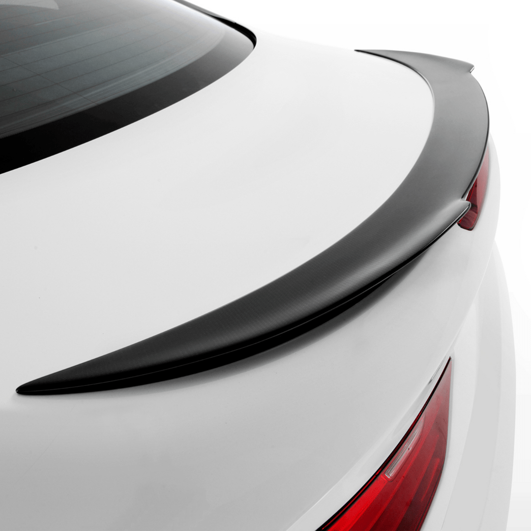 Vorsteiner Aerodynamics BMW F12 M6 carbon fiber V-Style Aero decklid spoiler on a sleek car, showcasing sporty aerodynamic design.