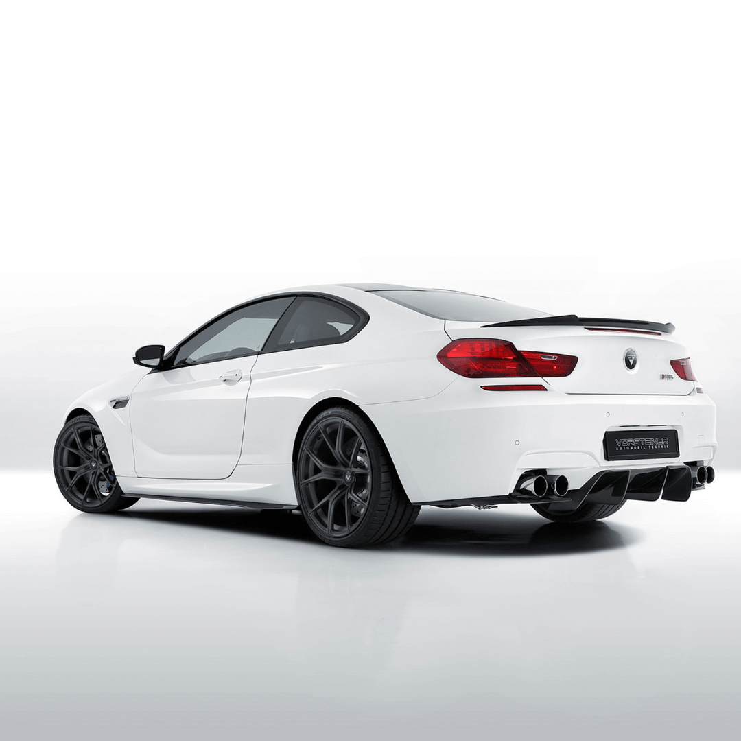 BMW F12 M6 V-Style Aero decklid spoiler by Vorsteiner Aerodynamics, featuring carbon fiber construction on a sleek sports car.