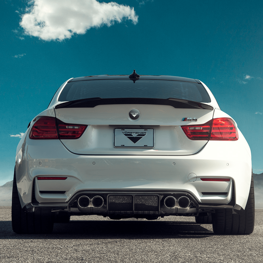 BMW F8X M3 M4 GTS Vorsteiner carbon fiber rear diffuser V-Style™ aerodynamic part, showcasing sleek design and high-performance materials.