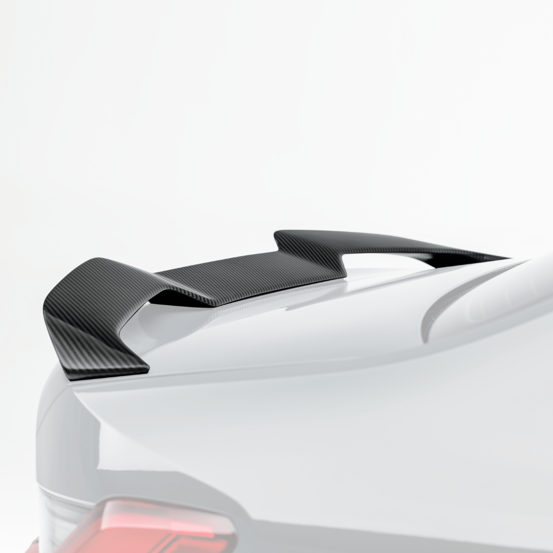 BMW G8X M3 carbon fiber decklid spoiler by Vorsteiner Aero, V-Style design enhances sporty look and aerodynamic performance.