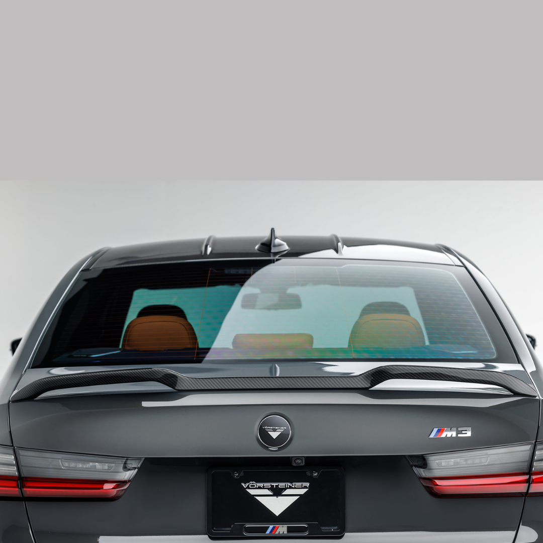 BMW G8X M3 carbon fiber decklid spoiler by Vorsteiner Aerodynamics, V-Style™ aero design on a sporty coupe.