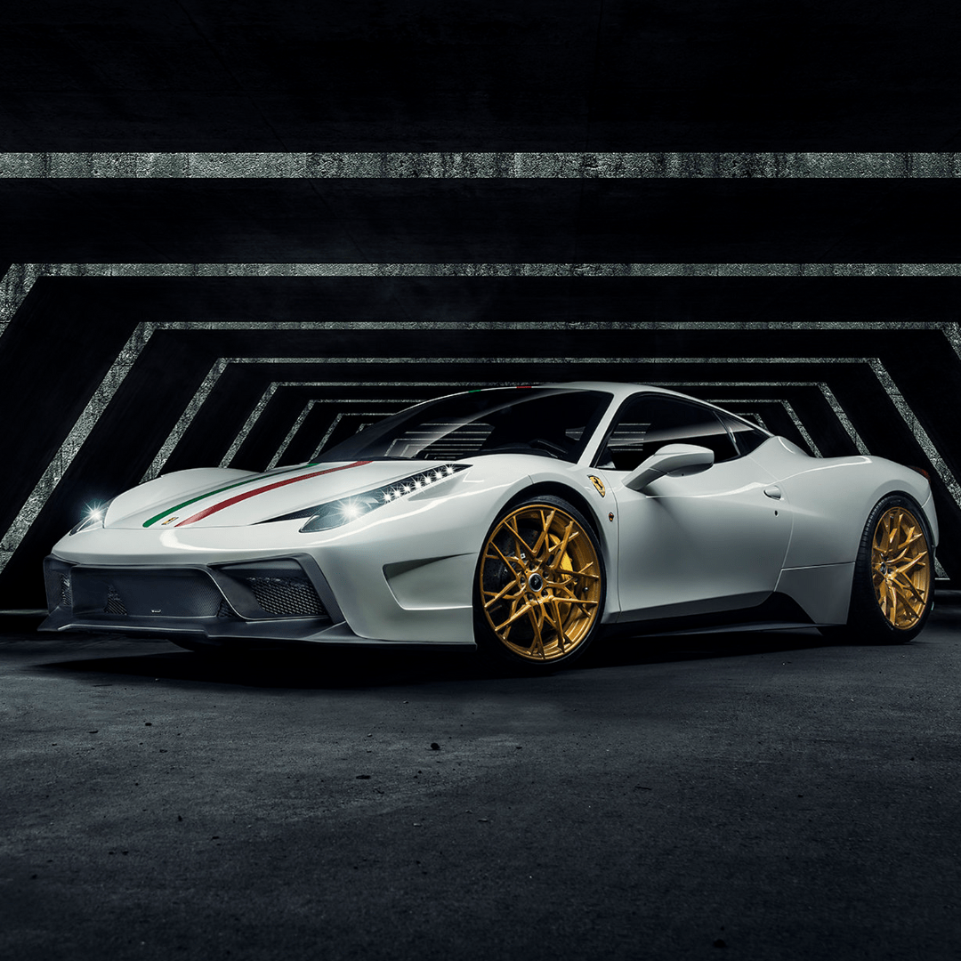 Ferrari 458 Italia VX carbon fiber front bumper with aero front spoiler by Vorsteiner Aerodynamics, showing sleek, aerodynamic design.