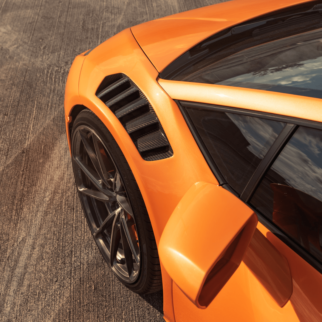 Lamborghini Huracan Novara Aero front fenders with integrated vents and splash shields in gloss carbon fiber by Vorsteiner Aerodynamics.