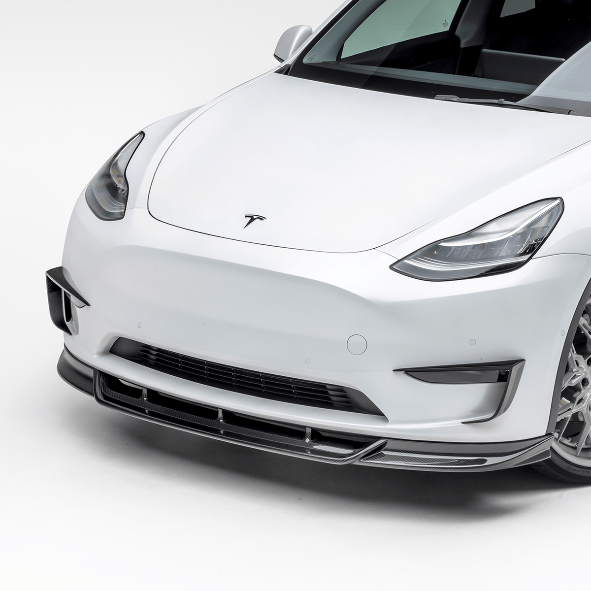 Tesla Model Y Aero Add-On Bumper Flares by Vorsteiner Aerodynamics, showcasing sleek, aerodynamic bumper flare design on vehicle.