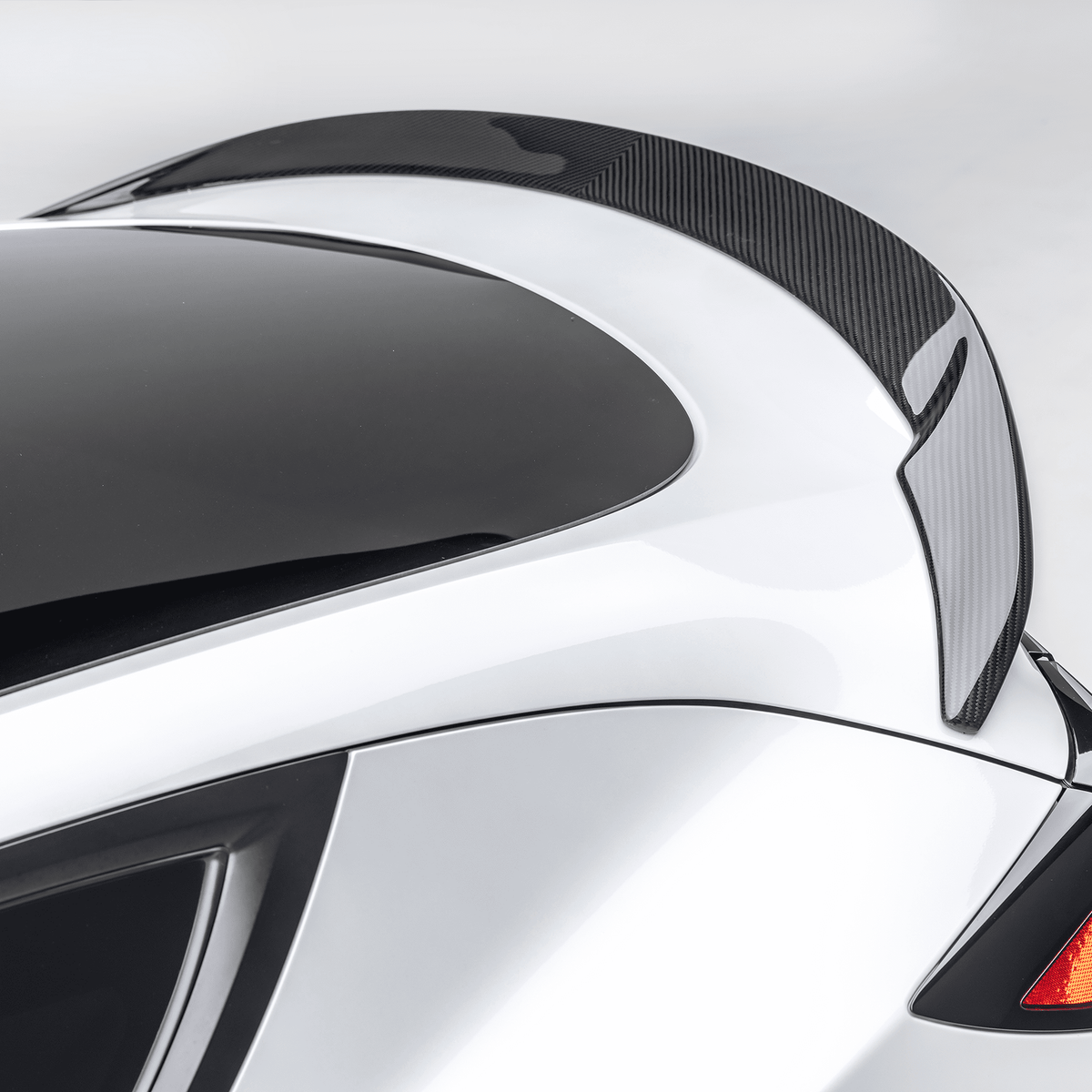 Tesla Model Y Aero Decklid Spoiler by Vorsteiner Aerodynamics, showing sleek aerodynamic design on the car's rear decklid.