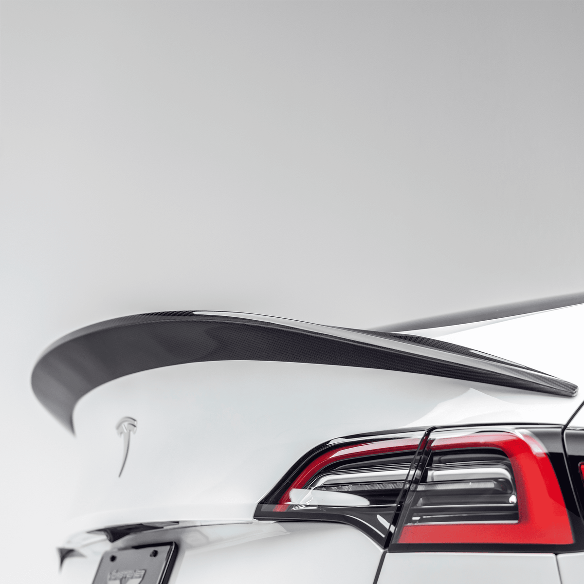 Tesla Model Y Aero Decklid Spoiler by Vorsteiner Aerodynamics, showing the sleek, aerodynamic design on the rear decklid.