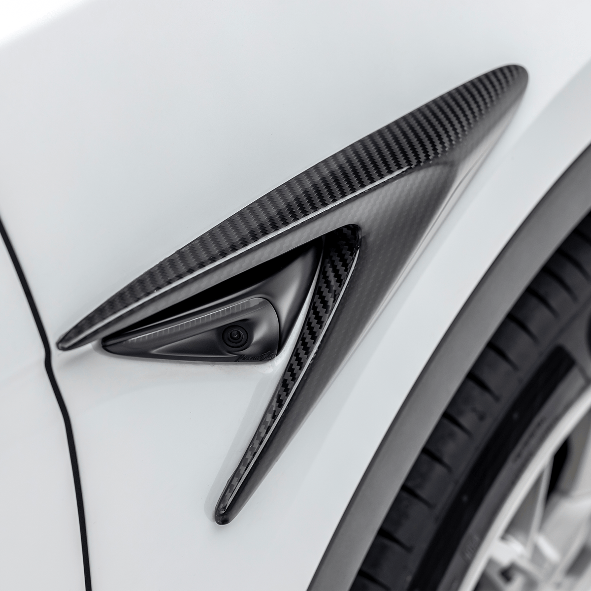 Tesla Model Y Aero Add-On Fender Vents by Vorsteiner Aerodynamics, showcasing sleek black vent design on the vehicle's fender.