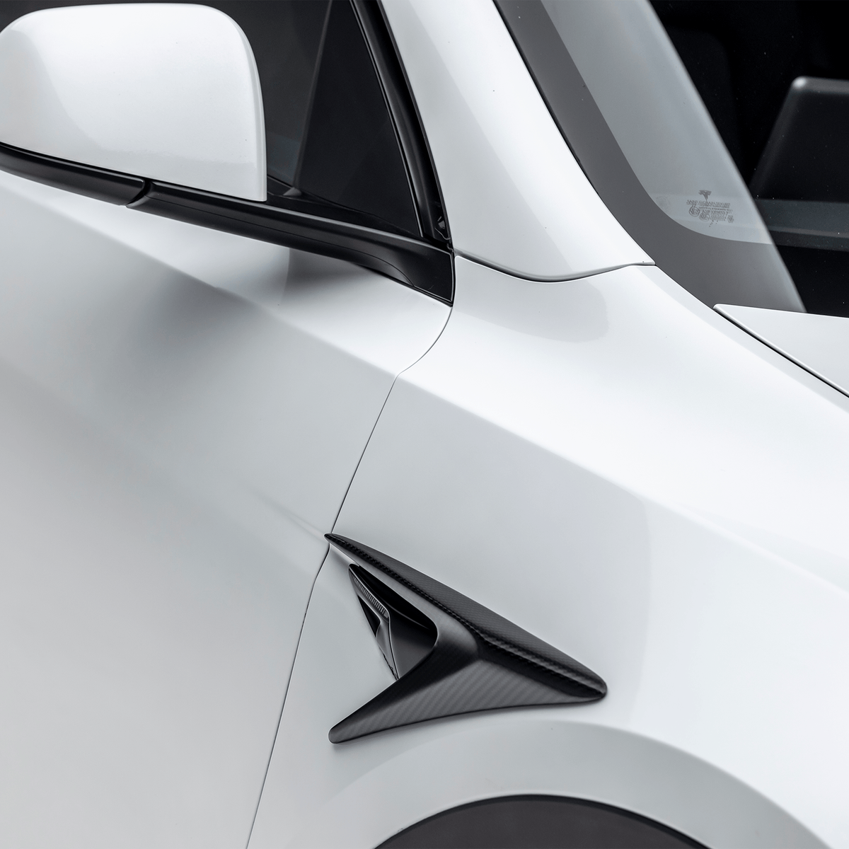 Vorsteiner Aero fender vents installed on a Tesla Model Y, showcasing sleek aerodynamic enhancements and vent design details.