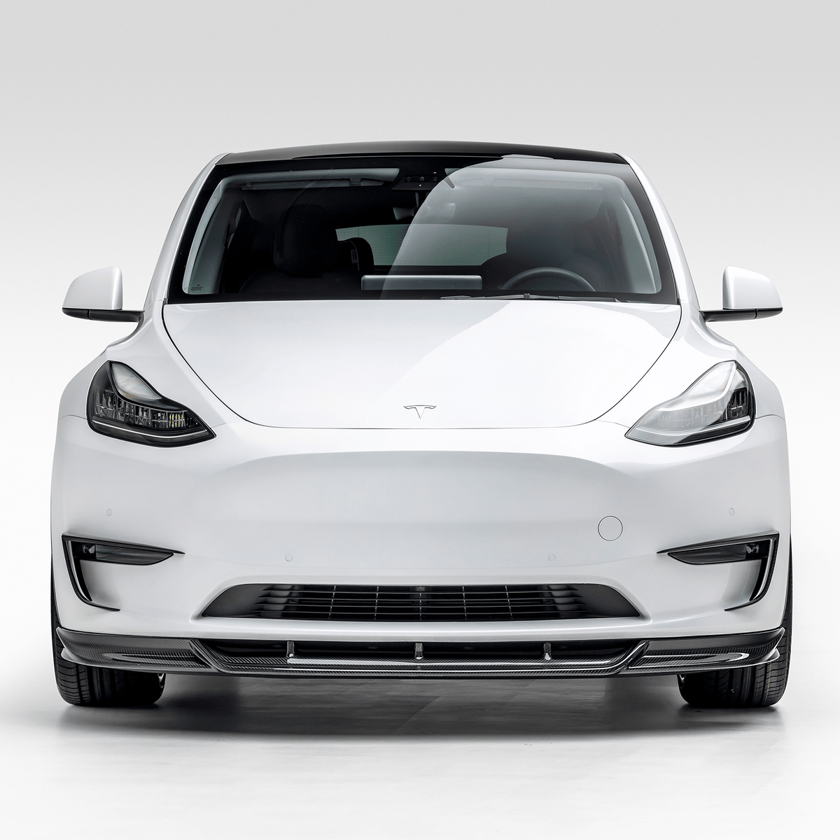 Vorsteiner Aerodynamics Tesla Model Y Aero front spoiler showcasing sleek, aerodynamic design for enhanced vehicle performance.