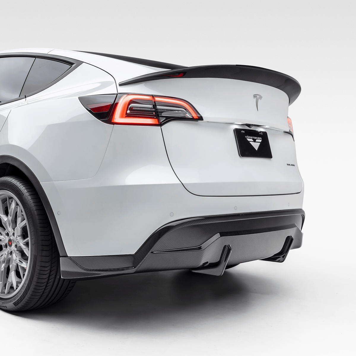 Tesla Model Y Aero Rear Diffuser by Vorsteiner Aerodynamics, showcasing the sleek black aerodynamic rear diffuser for enhanced vehicle performance.