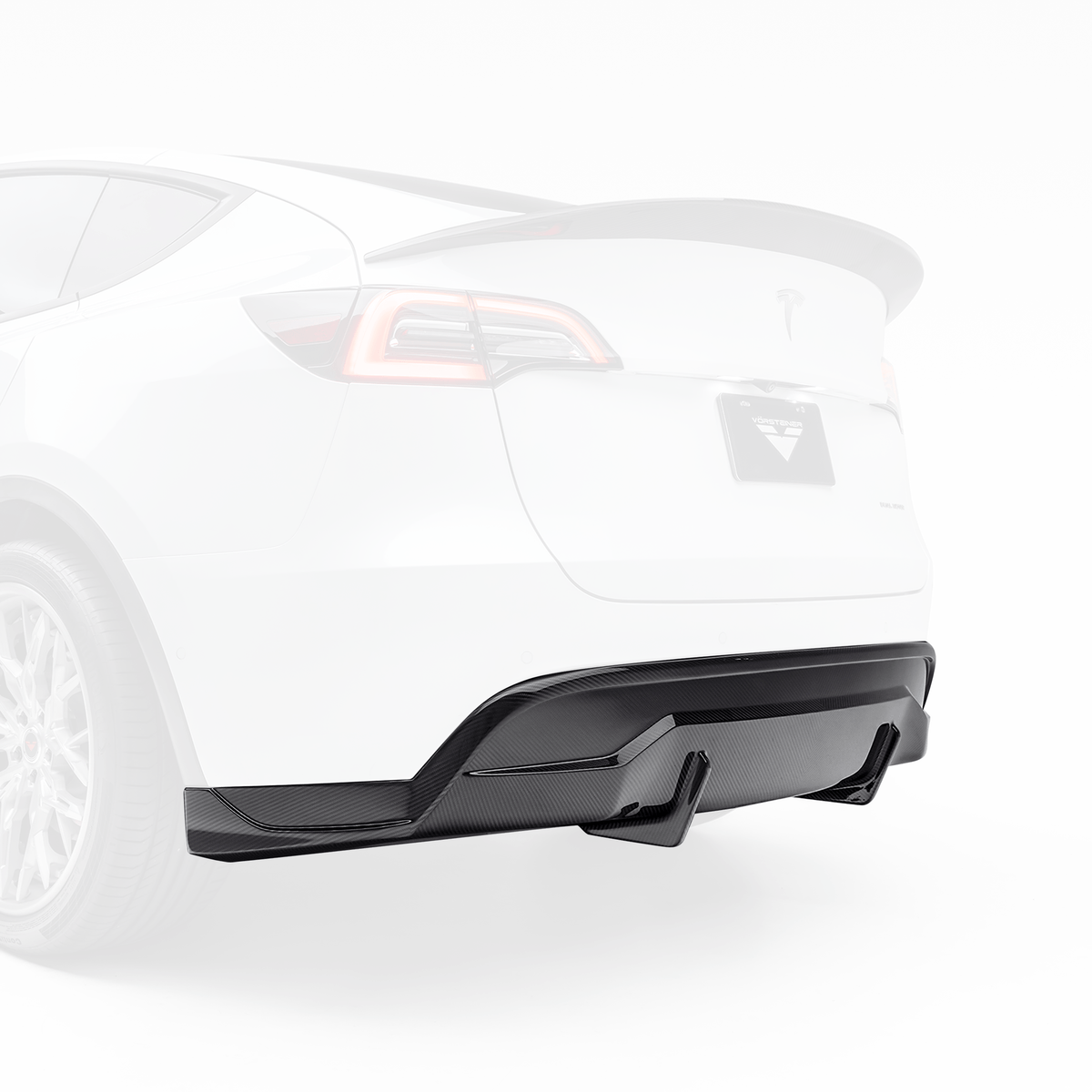 Tesla Model Y Aero rear diffuser by Vorsteiner Aerodynamics, showcasing the sleek black aerodynamic car part in detail.