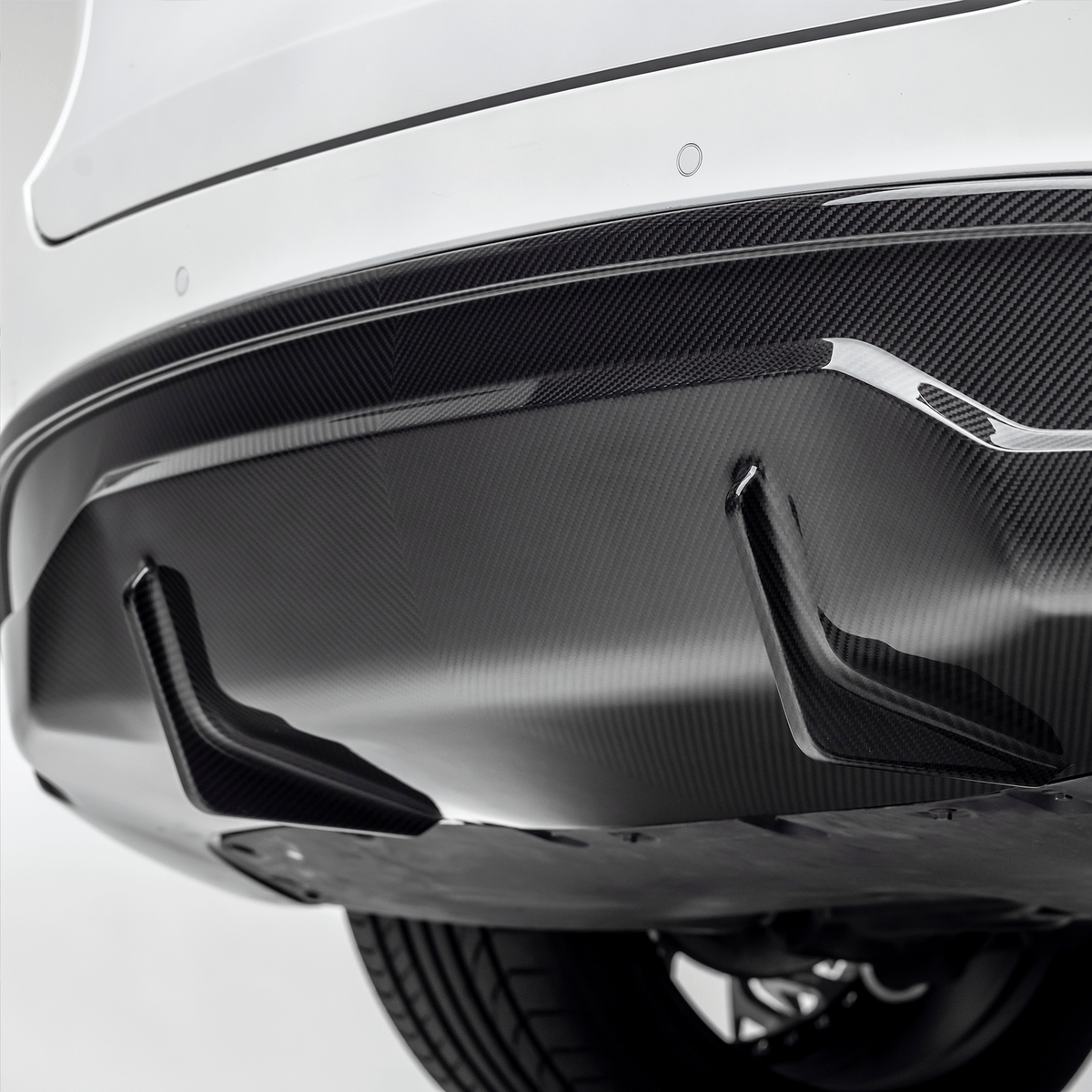 Tesla Model Y Aero Rear Diffuser by Vorsteiner Aerodynamics, showcasing the sleek, aerodynamic black diffuser component.