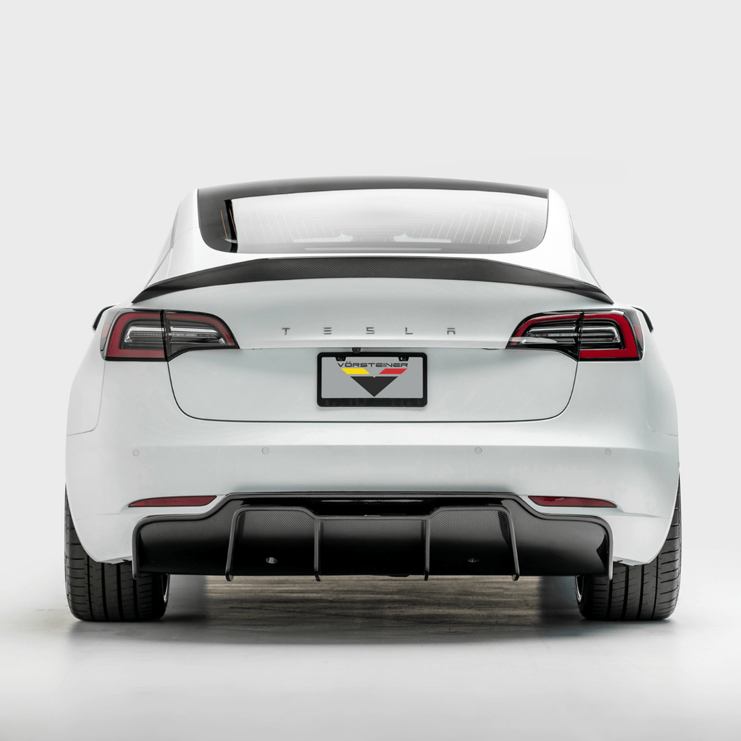Tesla Model 3 Volta Aero Decklid Spoiler by Vorsteiner Aerodynamics, featuring a sleek carbon-fiber design on the car's rear.