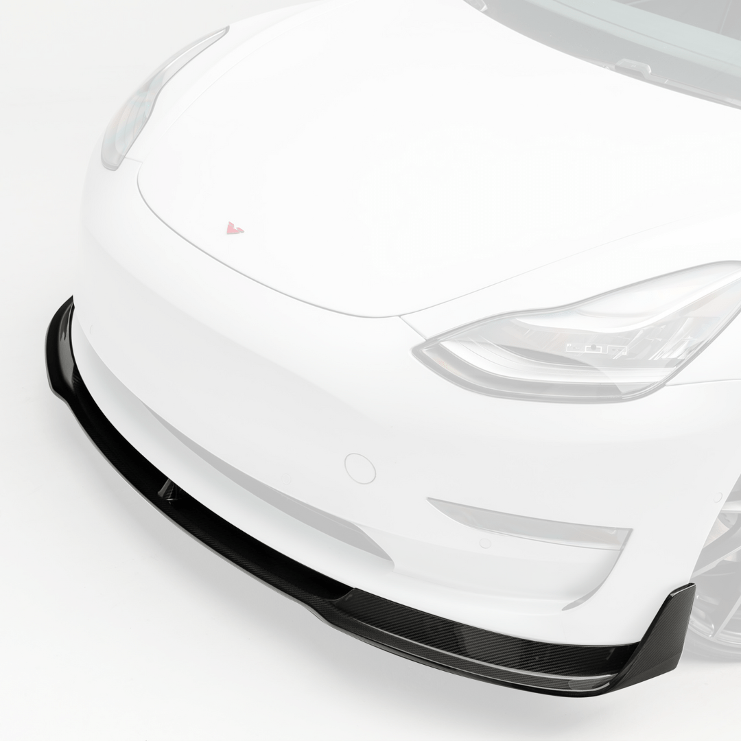 Vorsteiner Aerodynamics Tesla Model 3 Volta Aero front spoiler in carbon fiber, showcasing its sleek aerodynamic design.