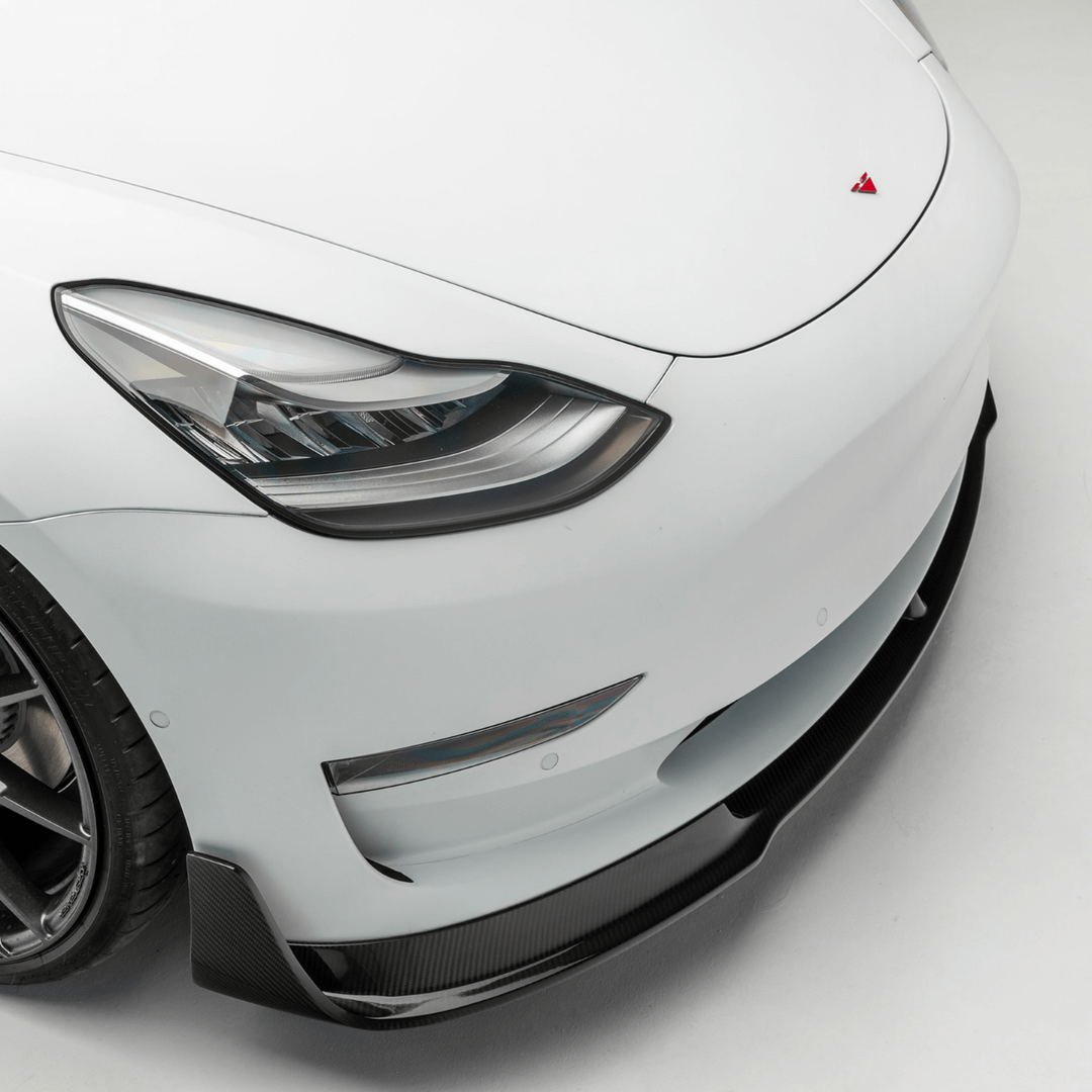 Tesla Model 3 Volta Aero front spoiler by Vorsteiner Aerodynamics, featuring carbon fiber design and sleek aerodynamic styling.