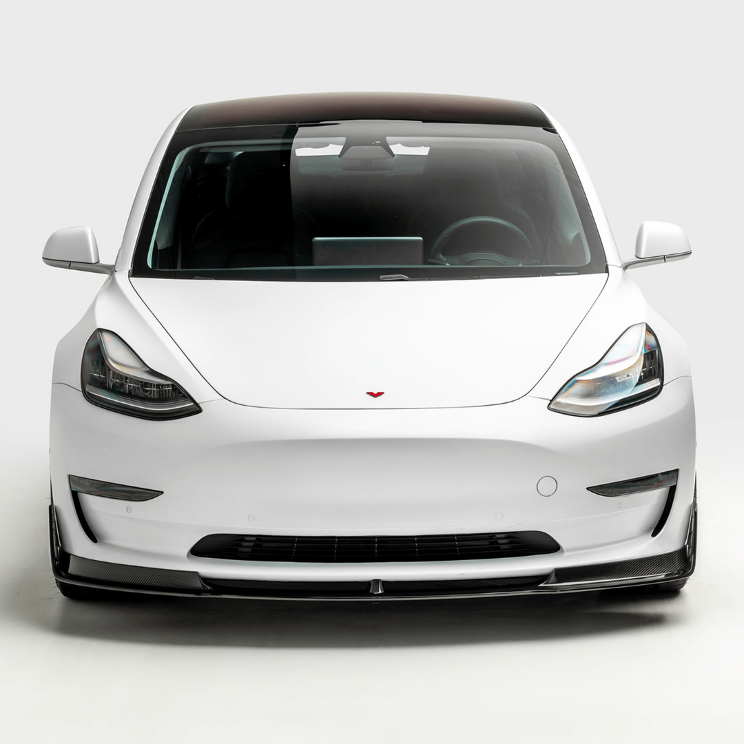 Tesla Model 3 Volta Aero front spoiler by Vorsteiner Aerodynamics, featuring carbon fiber construction and aerodynamic design details.