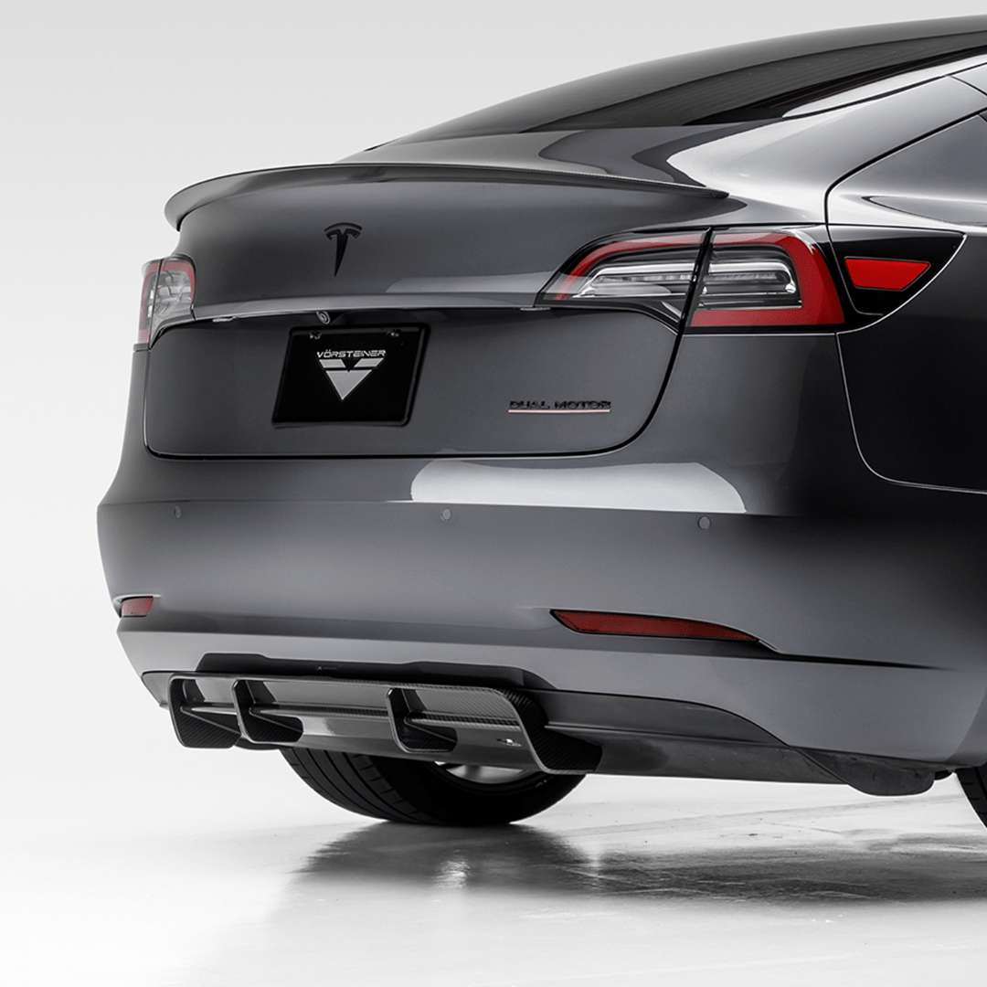Tesla Model 3 Volta Aero rear diffuser by Vorsteiner Aerodynamics in carbon fiber, showcasing its sleek aerodynamic design.