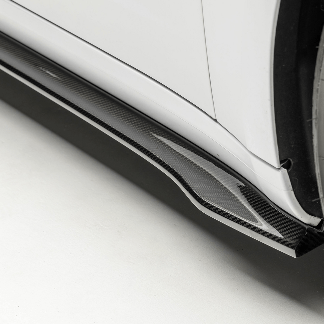 Tesla Model 3 Vorsteiner Aero Volta Aero side skirt in carbon fiber, sleek aerodynamic enhancement for the vehicle.