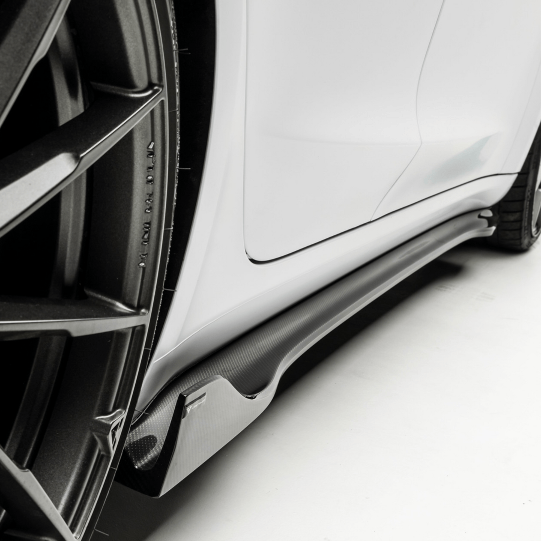 Tesla Model 3 Vorsteiner Aero Volta Aero side skirt in carbon fiber, showcasing sleek, aerodynamic design on the vehicle.