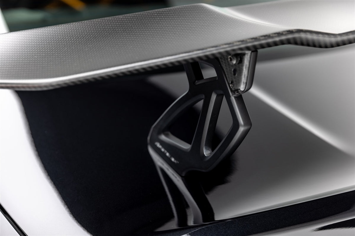 Vorsteiner BMW G8X M3 and M4 VRS GTS matte black aero uprights with carbon fiber aerodynamic wing.