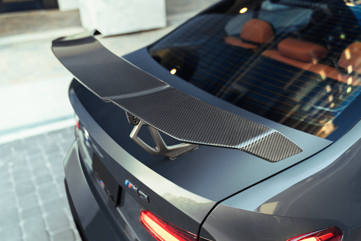 Vorsteiner BMW G80 M3 Aero Uprights with carbon fiber spoiler for enhanced aerodynamics and sporty appearance.