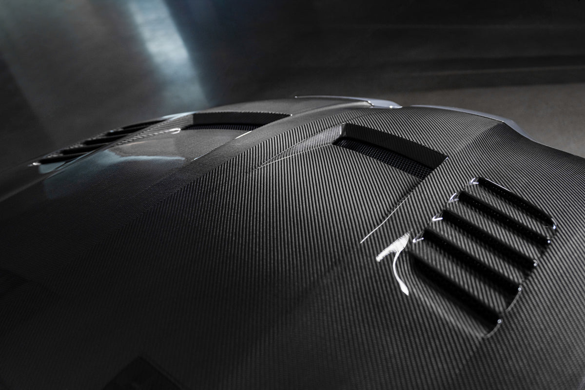 Vorsteiner GTS-V BMW G8X M3 M4 carbon fiber aero bonnet with V-Style design, showcasing lightweight, high-performance automotive styling.