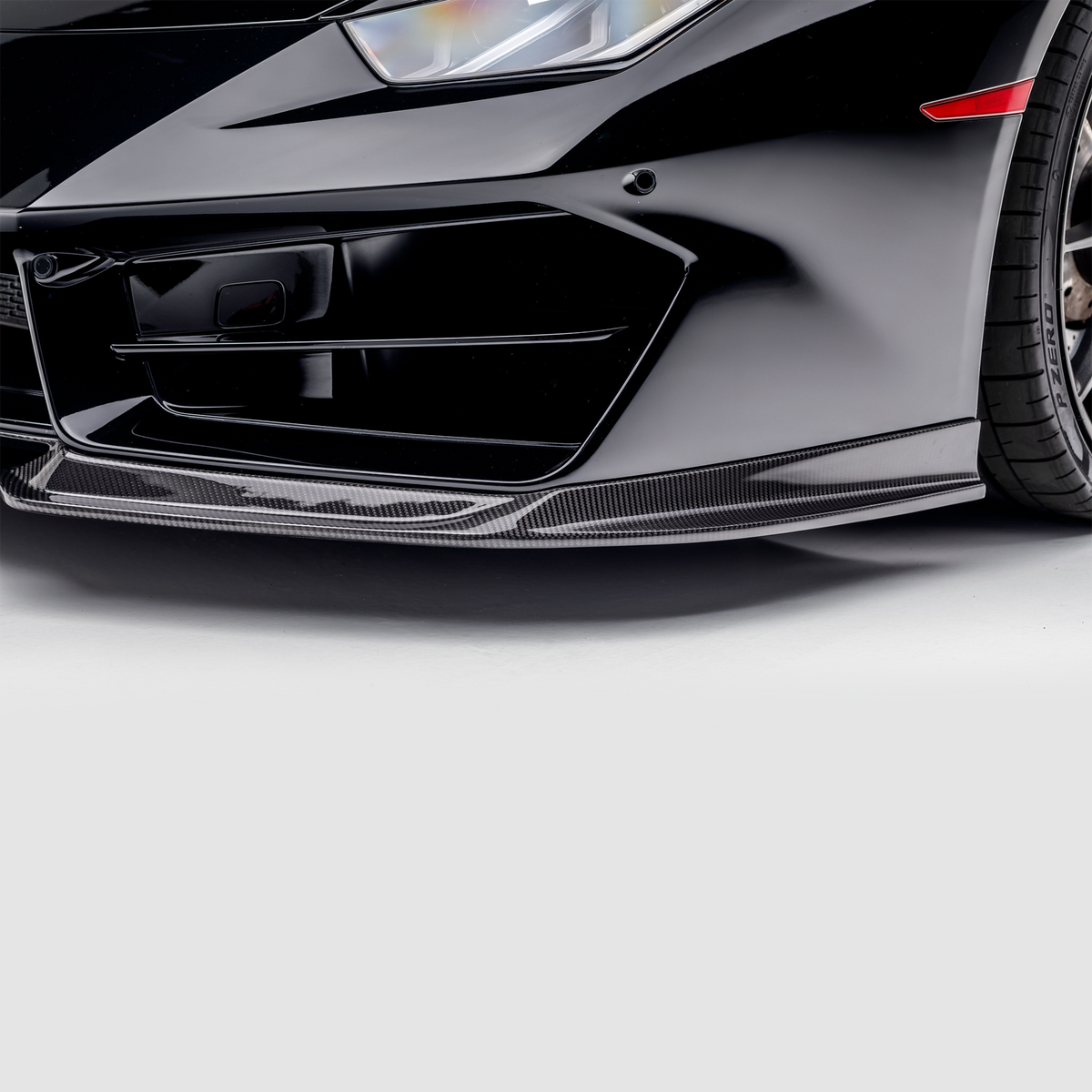 Vorsteiner Lamborghini Huracan LP580 Mondiale Aero front spoiler in carbon fiber, showcasing sleek aerodynamic design.